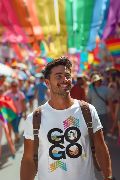 A person smiling and walking in a colorful parade, wearing a white GoGo t-shirt with a geometric pattern.